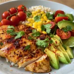 ['Juicy honey lime chicken served over a bed of avocado rice with colorful vegetables.', 'Close-up dish featuring tender chicken, creamy avocado, and vibrant cherry tomatoes.', 'Healthful bowl showcasing lime-infused chicken with rice, avocado slices, and greens.', 'Deliciously arranged honey lime chicken, avocado, and fresh ingredients in a rice bowl.']