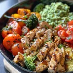 ['A vibrant low carb bowl featuring chicken breast, cauliflower rice, and fresh vegetables.', 'A close-up view of a delicious low carb meal with diced chicken, broccoli, and cherry tomatoes.', 'A colorful bowl filled with chicken, cauliflower rice, and assorted fresh vegetables.', 'A healthy low carb dish showcasing grilled chicken, spinach, and carrots in a bowl.']
